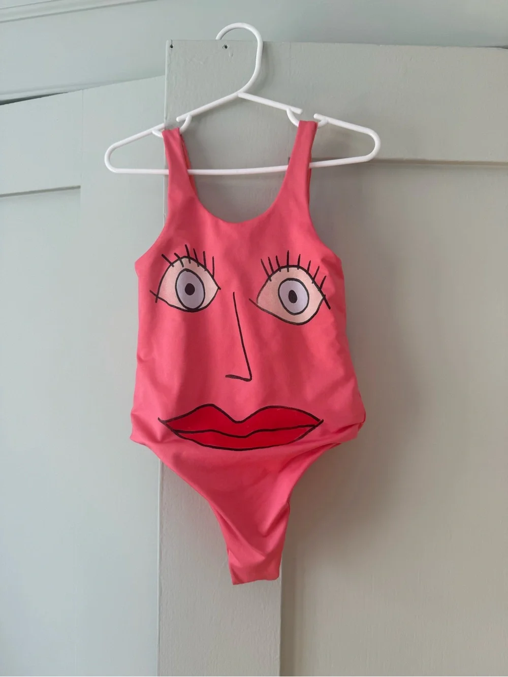 Kids Pink One-Piece Swimsuit with Face Graphic